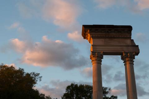 Cobb Institute Pillars against a sunset